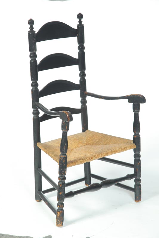 Appraisal: LADDERBACK ARMCHAIR American th century hardwood Old black paint Four