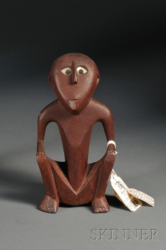 Appraisal: Melanesian Carved Wood Figure Tobi Island the stylized squatting form