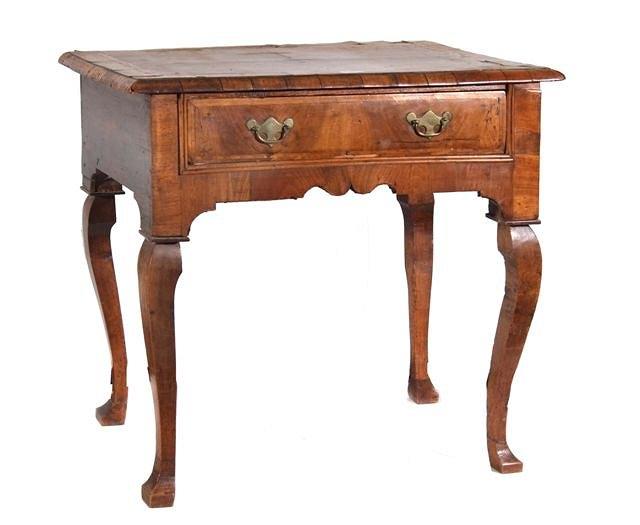 Appraisal: An th Century walnut veneered low boy having a rectangular