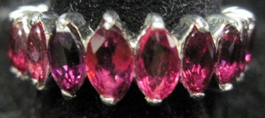 Appraisal: karat white gold ruby eternity bandTwenty three graduated marquise cut