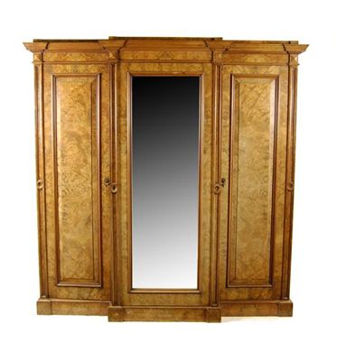 Appraisal: A Victorian burr walnut breakfront wardrobe the central bevelled mirror