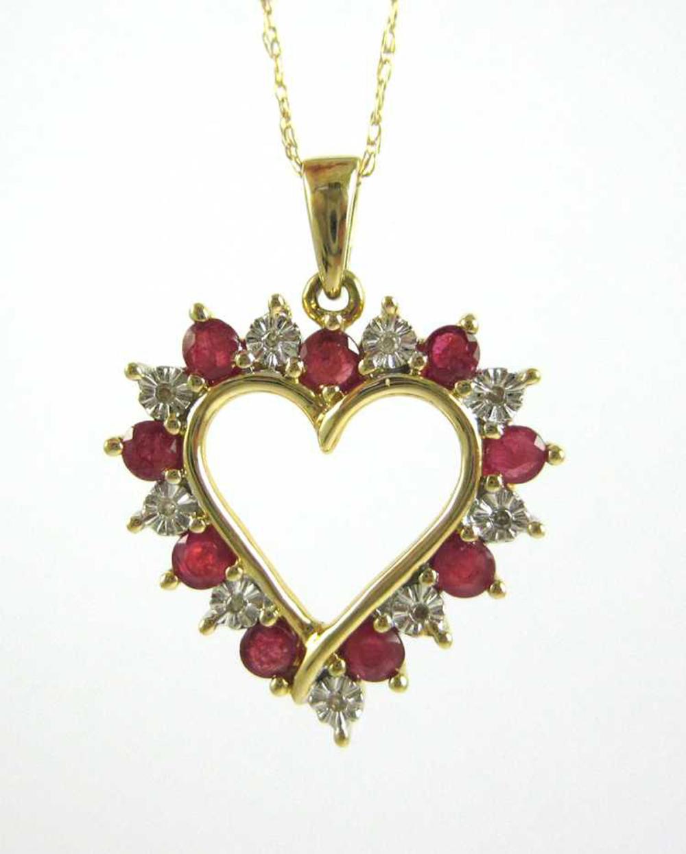 Appraisal: RUBY DIAMOND AND FOURTEEN KARAT GOLD PENDANT NECKLACE with an