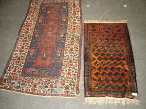 Appraisal: A Afghan prayer rug x cm and a Caucasian rug