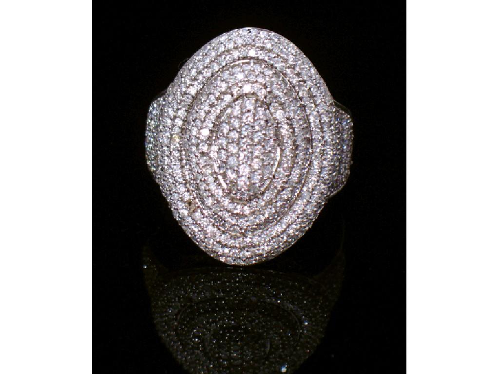 Appraisal: A DIAMOND-SET COCKTAIL RING pave-set overall with round brilliant-cut diamonds