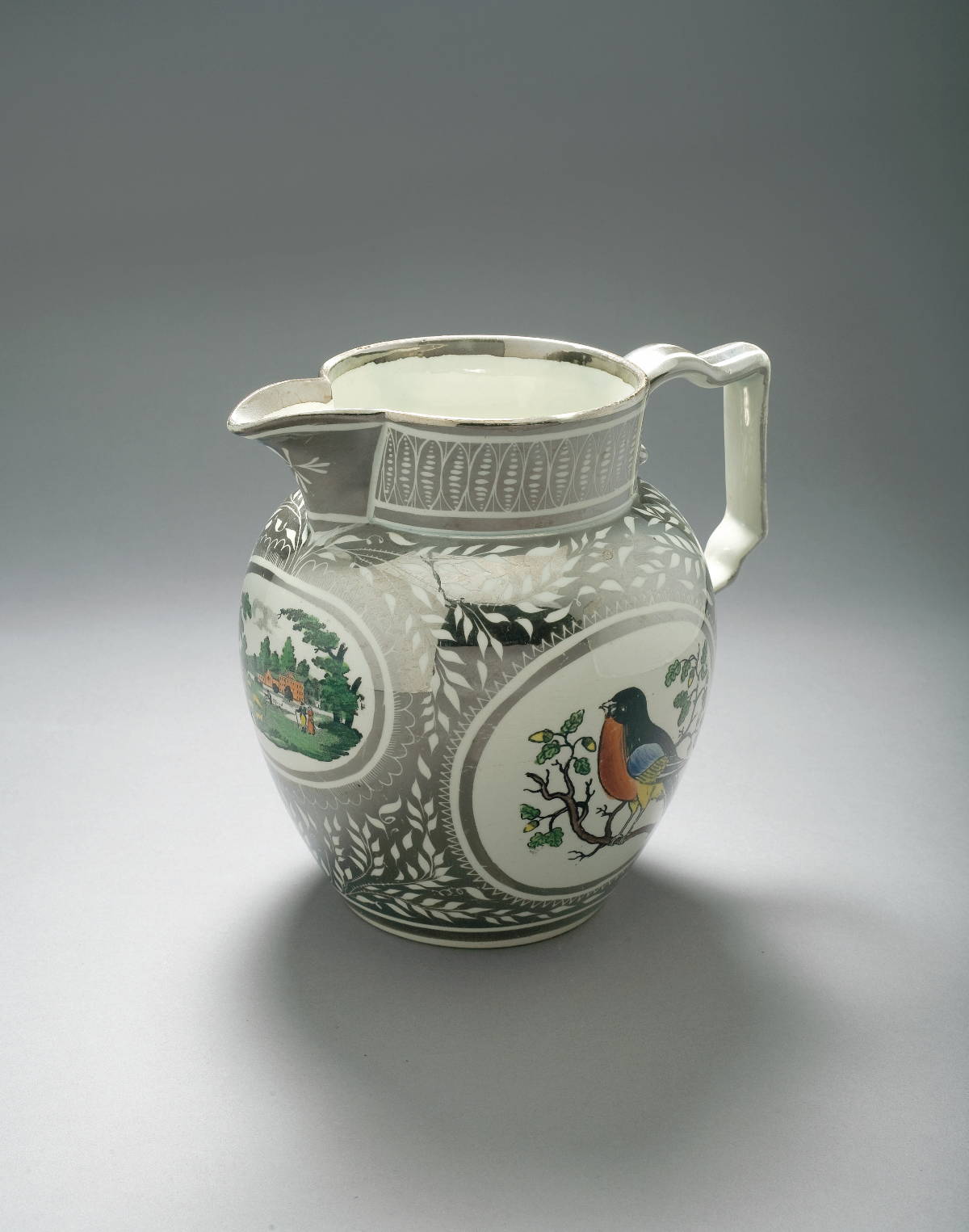 Appraisal: STAFFORDSHIRE SILVER RESIST LUSTRE AND ENAMEL-DECORATED 'ROBIN' JUG CIRCA -