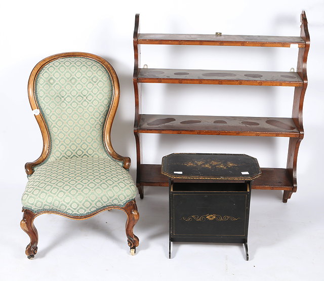 Appraisal: A VICTORIAN WALNUT LOW OCCASIONAL CHAIR with shaped upholstered back