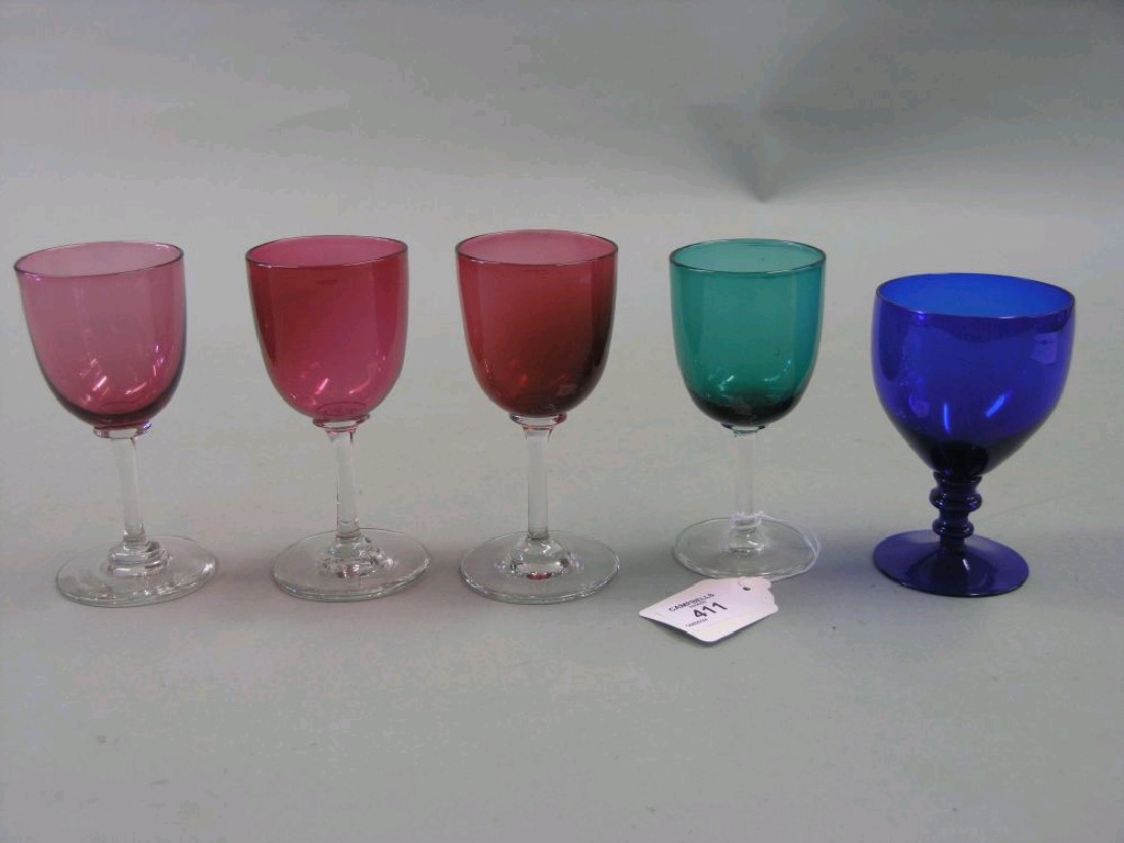 Appraisal: Four various Victorian glass wine glasses three with cranberry coloured