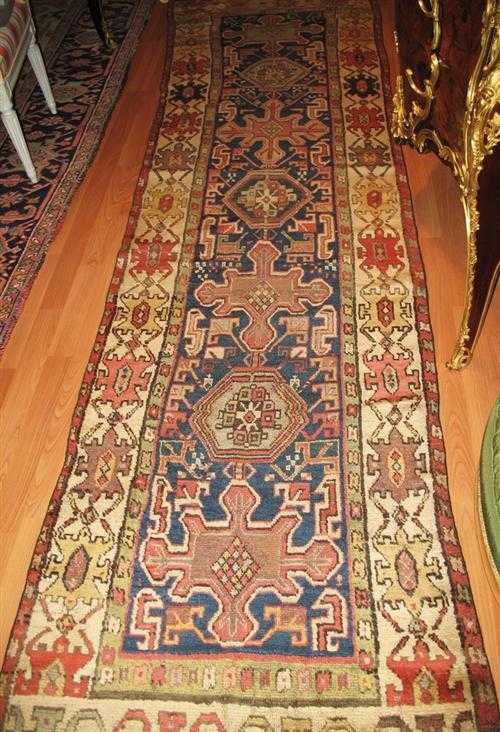 Appraisal: CAUCASIAN runner antique Dark blue central field geometrically patterned with