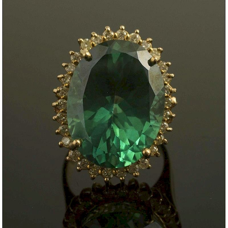 Appraisal: Teal Topaz Diamond Gold Ring An irradiated teal topaz ring