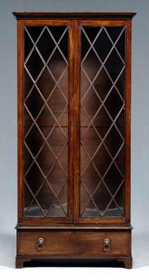 Appraisal: Georgian mahogany bookcase cabinet two glazed doors with diamond mullions