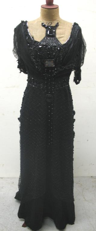 Appraisal: A full length black Victorian style dress the skirt and