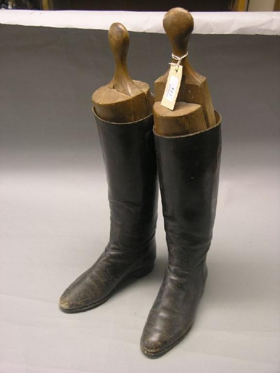 Appraisal: A pair of gentleman's leather riding boots complete with beech