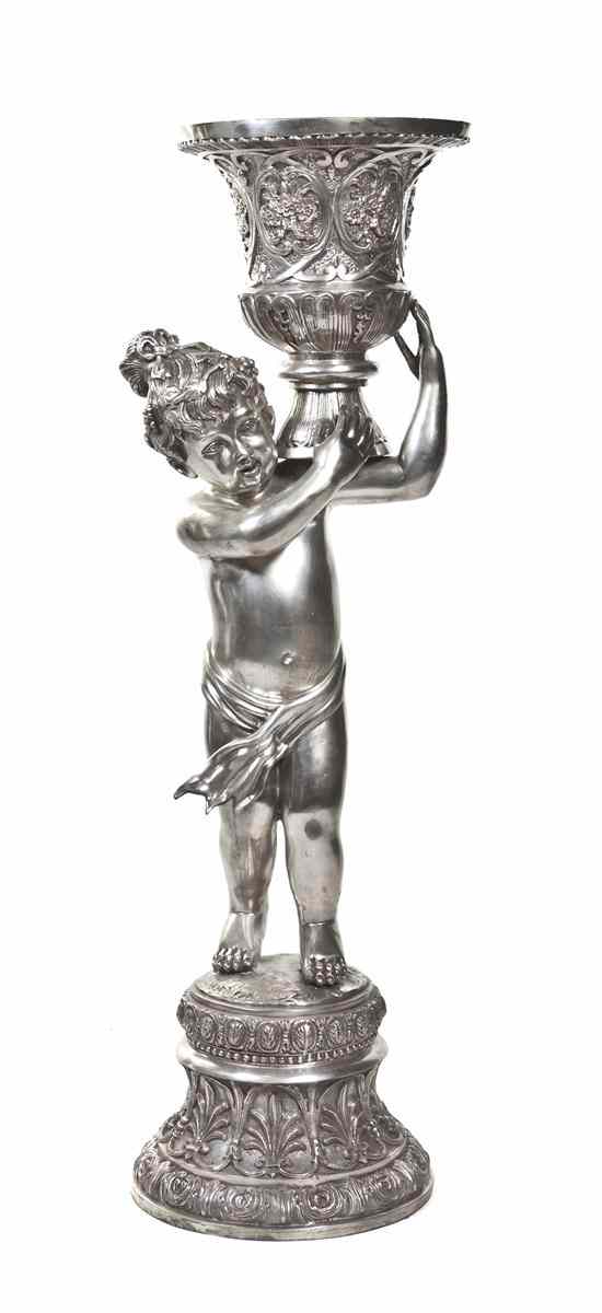 Appraisal: A Silvered Metal Figural Jardiniere cast as a putto supporting