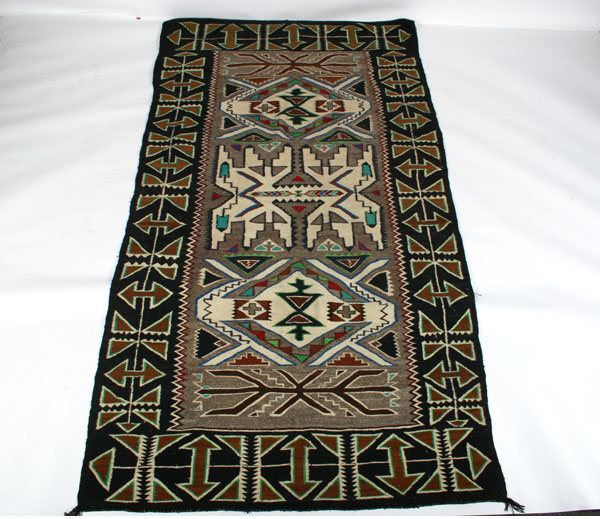 Appraisal: Large Navajo blanket rug vibrant chevron flanked by exuberant geometrics