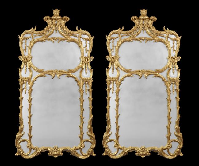 Appraisal: Pair of Carved Giltwood Bipartite Looking Glasses in the th-century