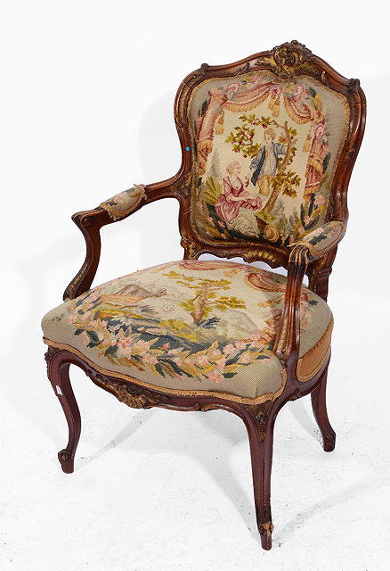 Appraisal: A LOUIS XV STYLE WALNUT AND PARCEL GILT FAUTEUIL with