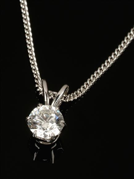 Appraisal: A diamond single stone pendant the brilliant cut diamond approximately