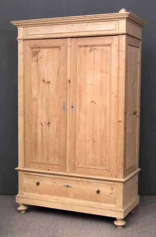 Appraisal: A th Century Continental stripped pine armoire enclosed by a