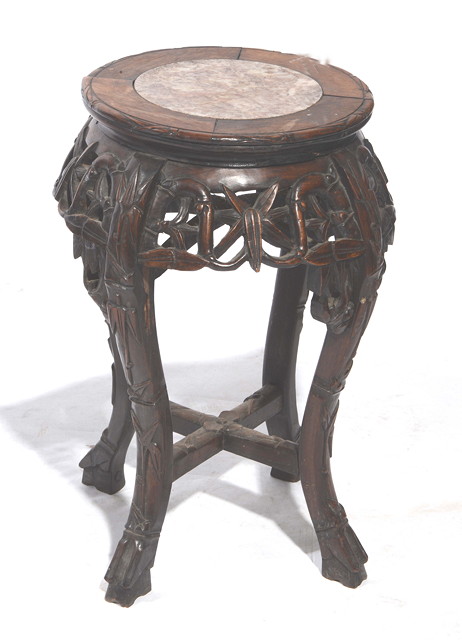 Appraisal: A CHINESE CARVED HARDWOOD LOW URN STAND with bamboo decoration