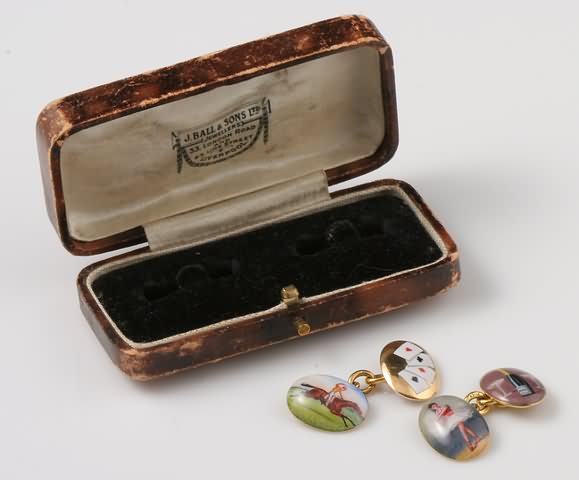 Appraisal: KY enameled picture cuff links Ballerina bottle of champagne deck