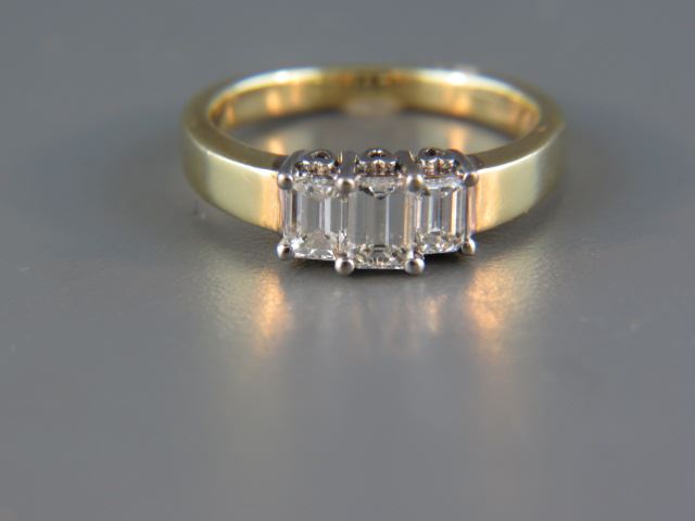 Appraisal: Diamond Ring a trio of emerald cut diamonds totaling carat