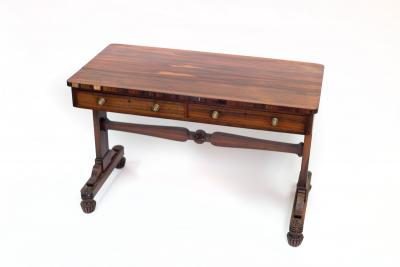 Appraisal: A Regency rosewood library table fitted two drawers on shaped