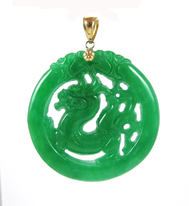 Appraisal: CHINESE JADE AND FOURTEEN KARAT GOLD PENDANT The large pendant