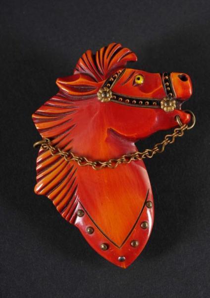 Appraisal: Bakelite Red Horse Head Pin with Chain Reins Condition Excellent