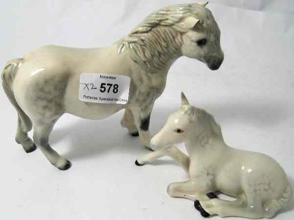 Appraisal: Beswick Grey Shetland Pony H and Grey Foal Lying Down