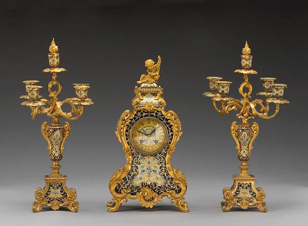 Appraisal: A French gilt bronze mounted champlev enamel three piece clock