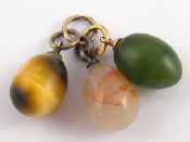 Appraisal: Three Russian miniature egg pendants one nephrite on a carat