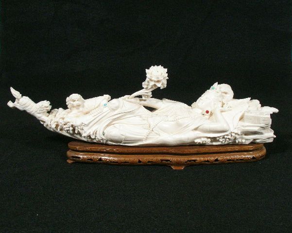 Appraisal: Carved Ivory Bodhisattva ivory reclining bohisattva holding lotus blossom w