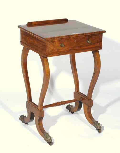 Appraisal: A TH CENTURY ROSEWOOD ADJUSTABLE TABLE with lyre shaped base