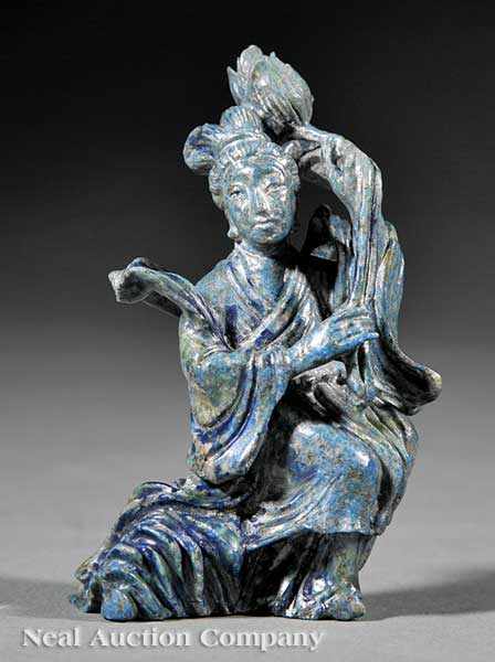 Appraisal: A Chinese Carved Stone Figure of a Maiden possibly apatite