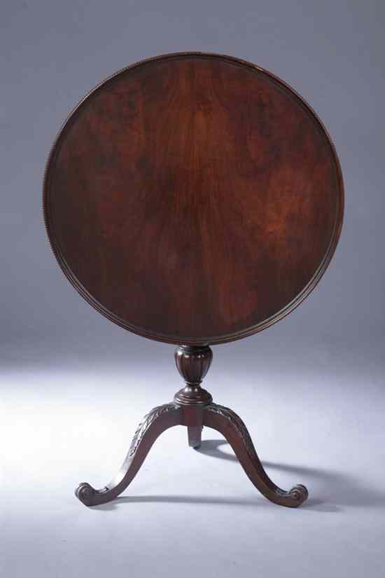 Appraisal: ENGLISH REGENCY STYLE MAHOGANY TILT-TOP TEA TABLE Round dished tilt-top