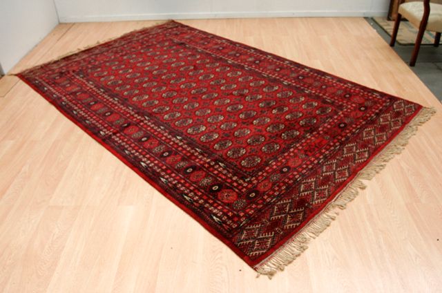 Appraisal: A Tekke carpet in crimson madder black and white signed