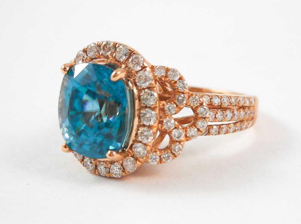 Appraisal: ZIRCON DIAMOND AND FOURTEEN KARAT ROSE GOLD RING with round-cut