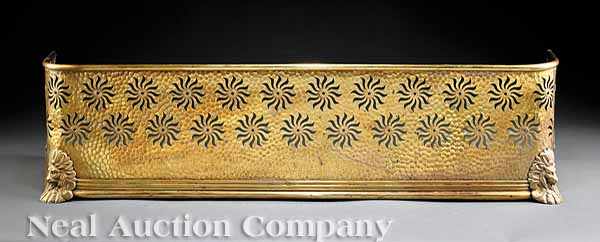 Appraisal: An Aesthetic Movement Brass Fireplace Fender th c the hand-hammered