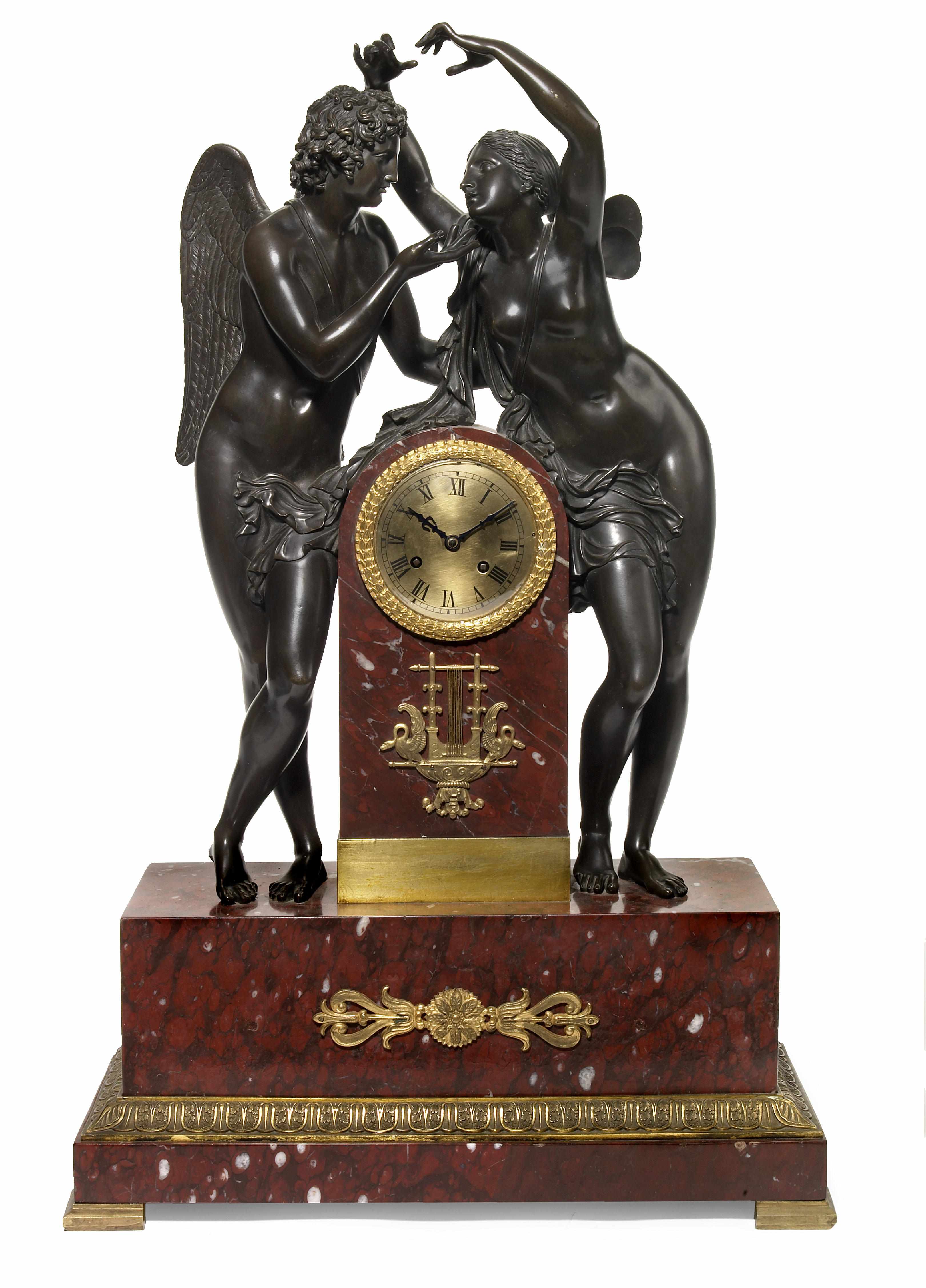 Appraisal: An imposing French gilt and patinated bronze and rouge marble