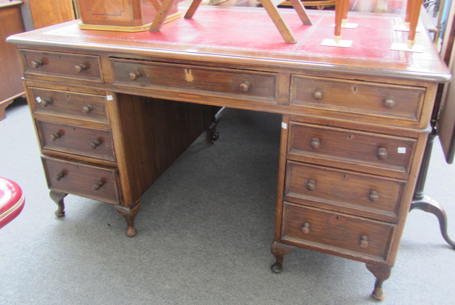 Appraisal: A th century pedestal desk with nine drawers about the