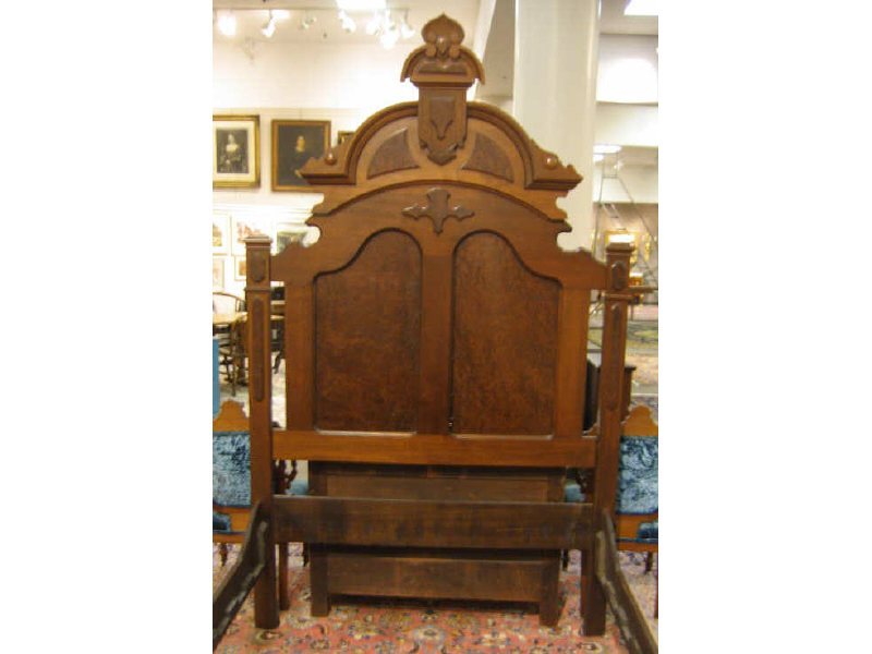 Appraisal: AMERICAN TH CENTURY WALNUT BEDSTEAD Arched headboard with carved scrolling