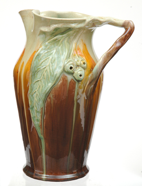 Appraisal: REMUED Victoria Circa Earthenware branch handled jug with applied gum