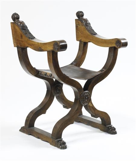 Appraisal: ITALIAN WALNUT 'SAVONAROLA' CHAIR CIRCA of typical folding X-form the