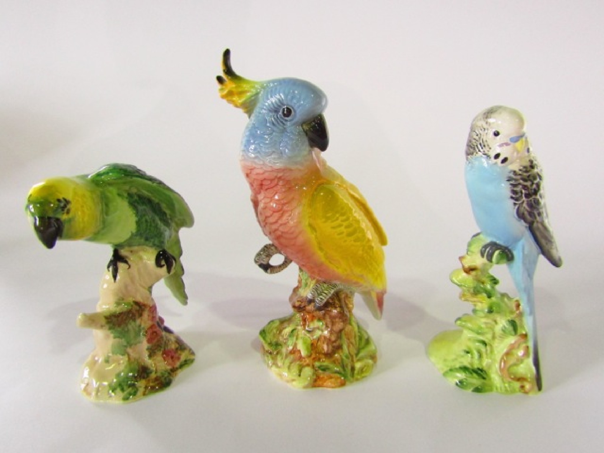 Appraisal: Three Beswick models of birds comprising a parakeet with green