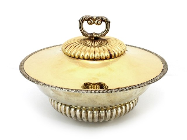 Appraisal: A Portuguese gilt circular bowl with a detachable cover having