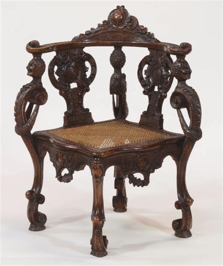 Appraisal: A th century carved walnut corner chair the top-rail with