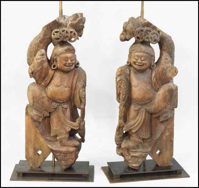 Appraisal: PAIR OF CHINESE CARVED WOOD FIGURES FITTED AS LAMPS Figure