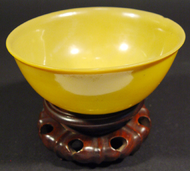 Appraisal: Oriental turned yellow hardstone bowl on a hardwood stand cm