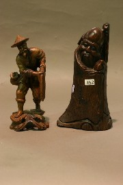 Appraisal: A wooden carving of a Japanese fisherman together with a