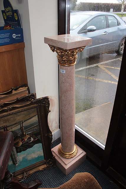 Appraisal: A MARBLE AND GILT METAL MOUNTED TORCHERE or urn stand